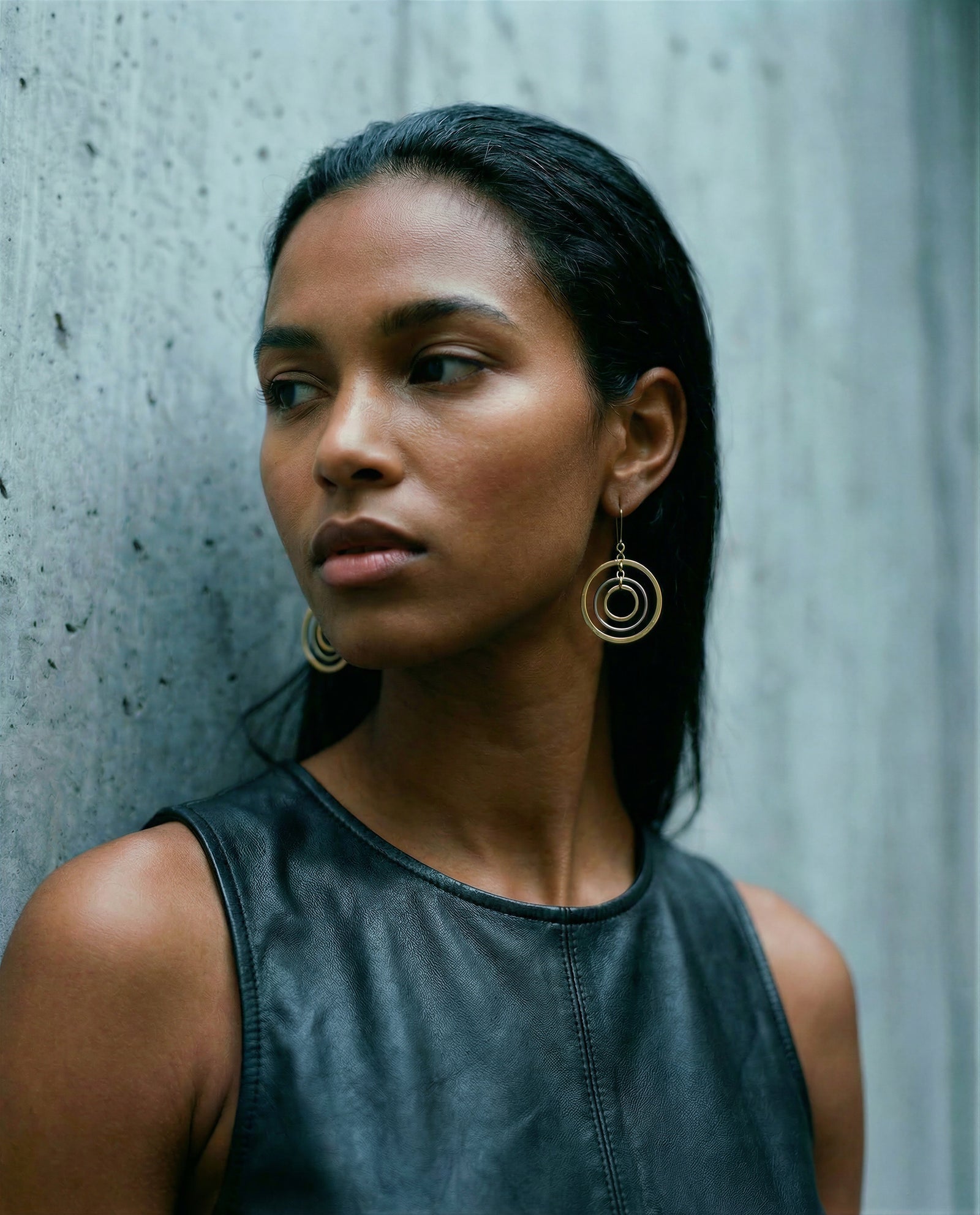 Image of a woman wearing the Cassini Align Earrings in Silver stainless steel from Lawless Jewellery