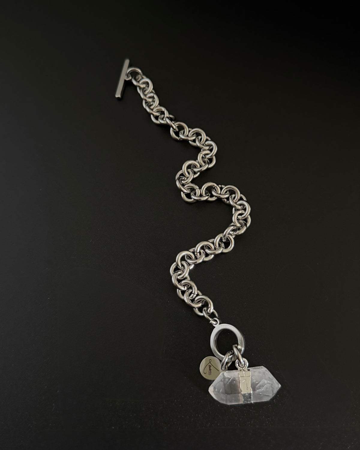 Silver stainless steel chain bracelet with raw clear quartz crystal detail on an 8 mm chain and toggle clasp, Athena Axiom Bracelet by Lawless Jewellery.