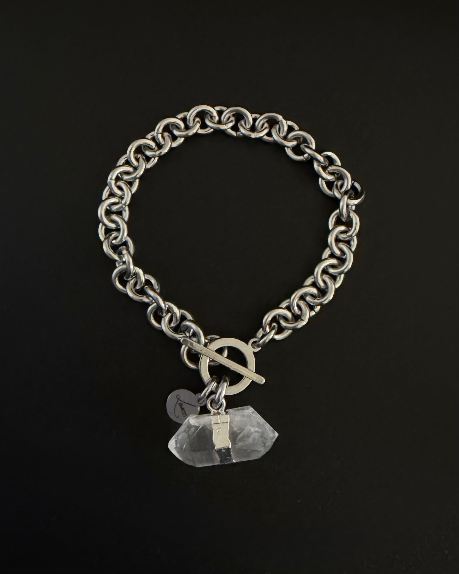 Silver stainless steel chain bracelet with raw clear quartz crystal detail on an 8 mm chain and toggle clasp, Athena Axiom Bracelet by Lawless Jewellery.