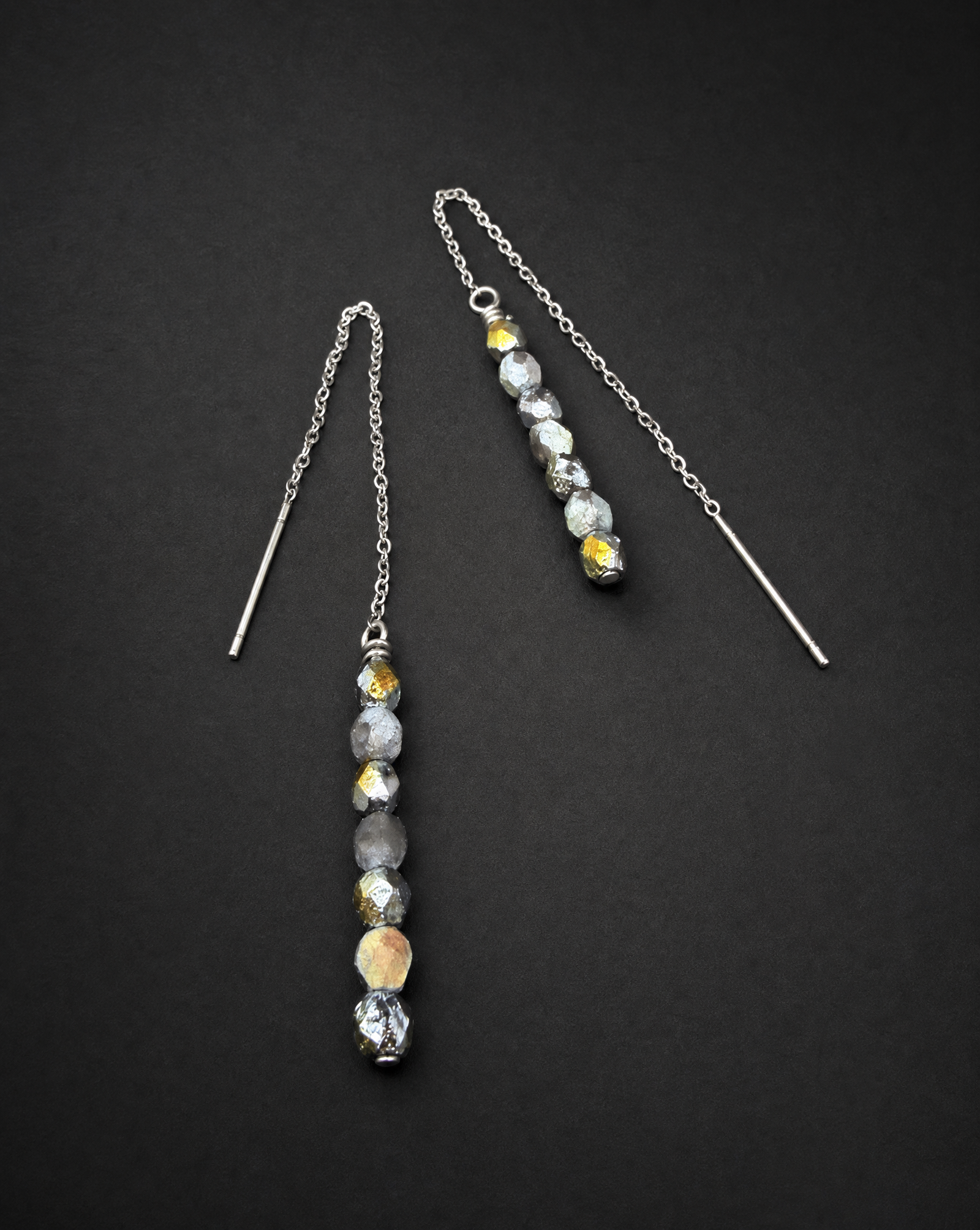 Pair of silver Eos Threshold Ear Threader Earrings with fine adjustable chains and faceted glass beads in mixed gold and silver tones.