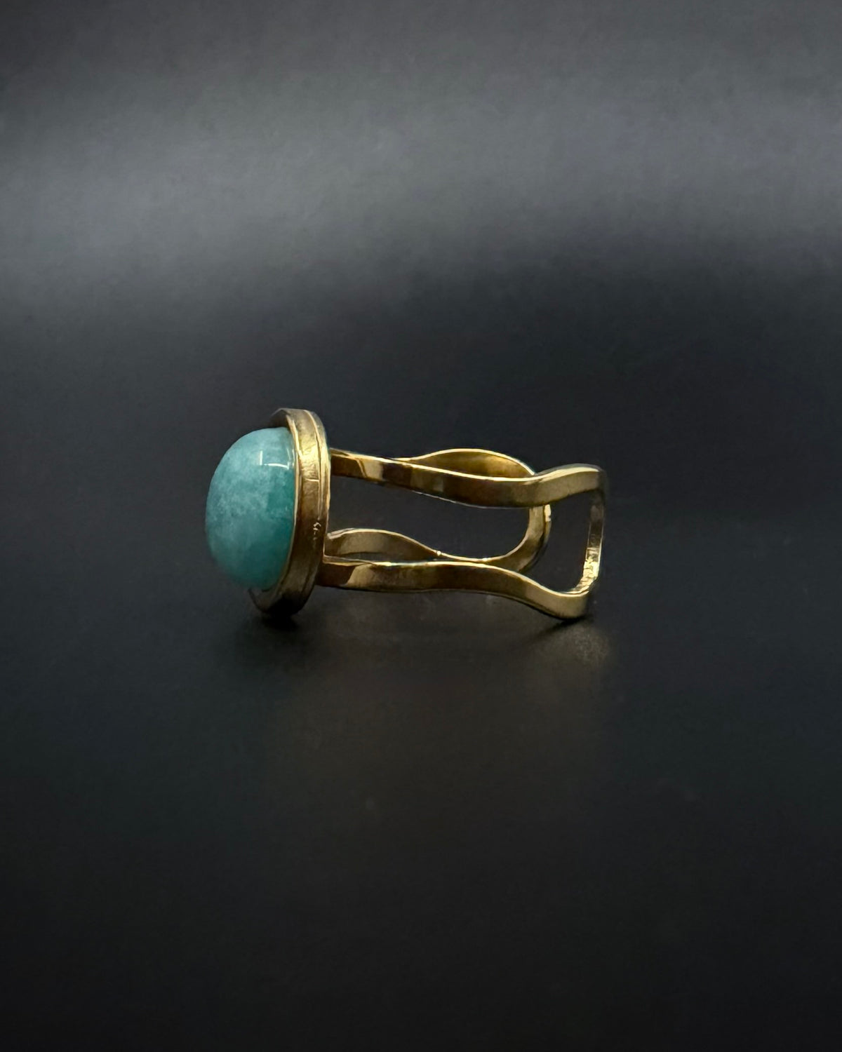 Silver adjustable double-shank ring with domed 10 mm amazonite gemstone in soft blue-green tones, Nebulae Core Ring by Lawless Jewellery.