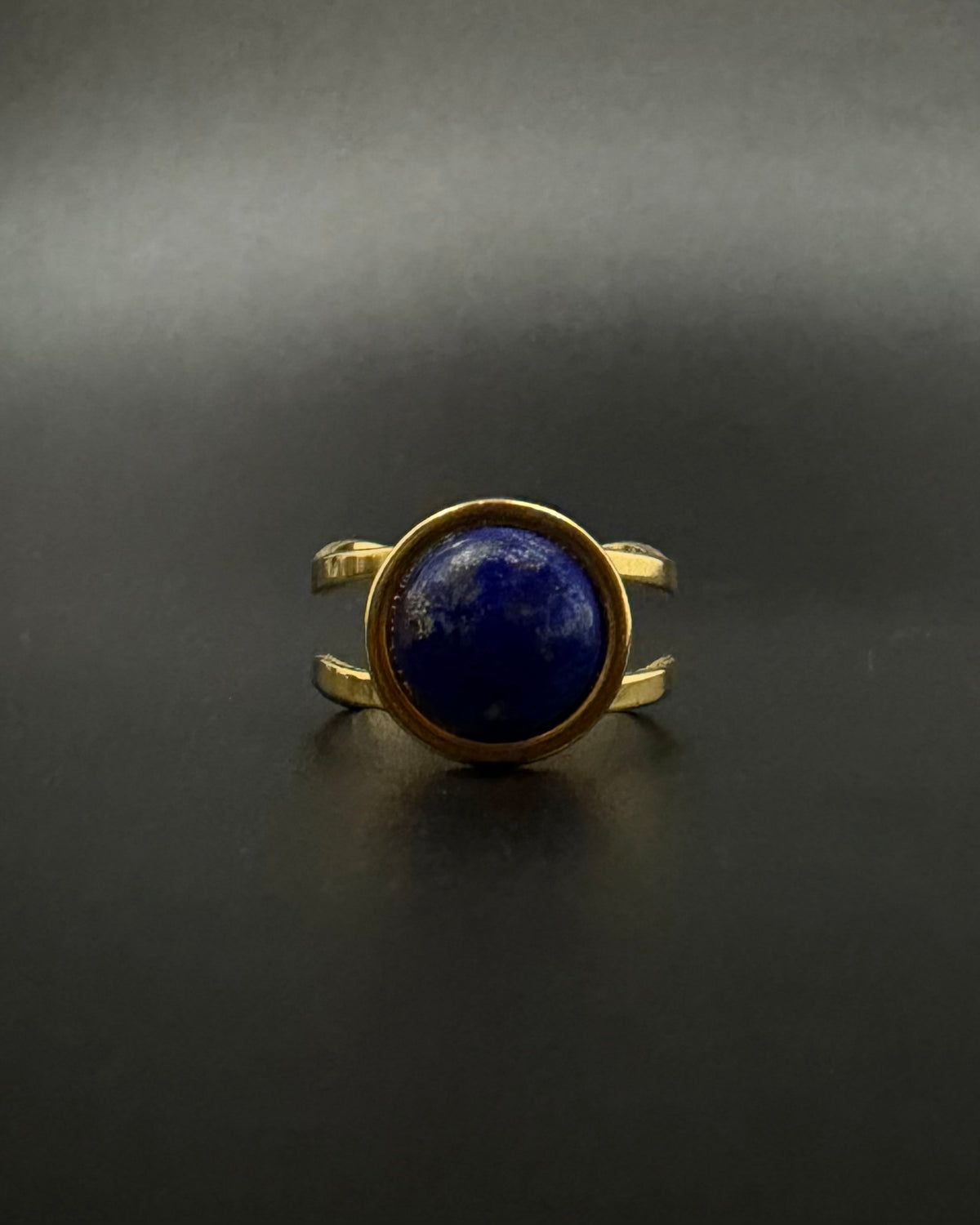 Nebulae Core adjustable ring in stainless steel featuring a 10mm lapis lazuli gemstone disc with deep blue and gold flecked detailing