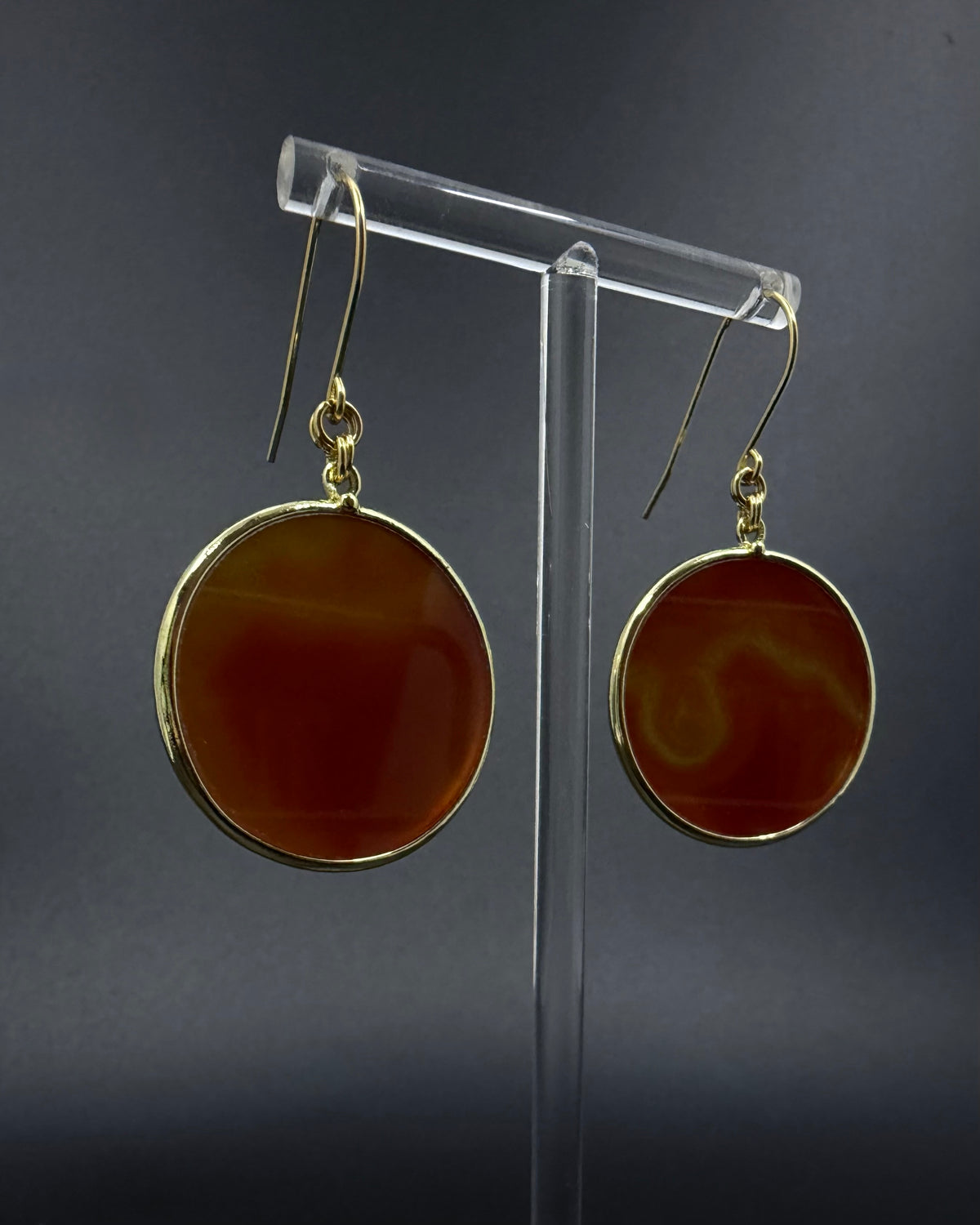Nebulae Trace Earrings in Carnelian featuring 30mm burnt orange gemstone discs with gold stainless steel hooks, celestial statement drop earrings by Lawless Jewellery