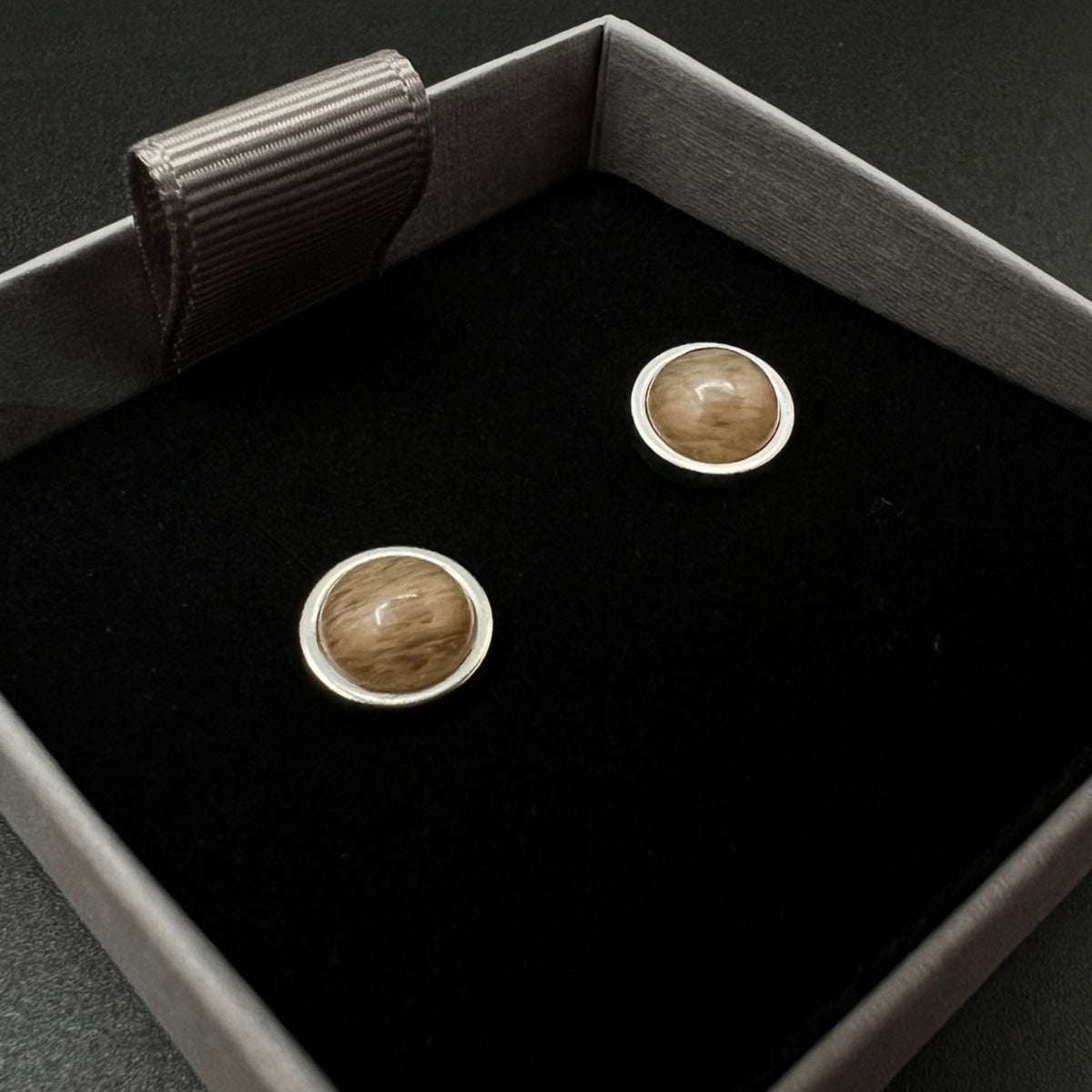 Stainless steel stud earrings with domed yellow-orange watermelon glass cabochons, 10 mm studs with 8 mm cabochons — Lawless Jewellery.