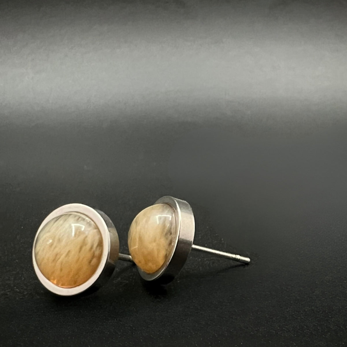 Stainless steel stud earrings with domed yellow-orange watermelon glass cabochons, 10 mm studs with 8 mm cabochons — Lawless Jewellery.