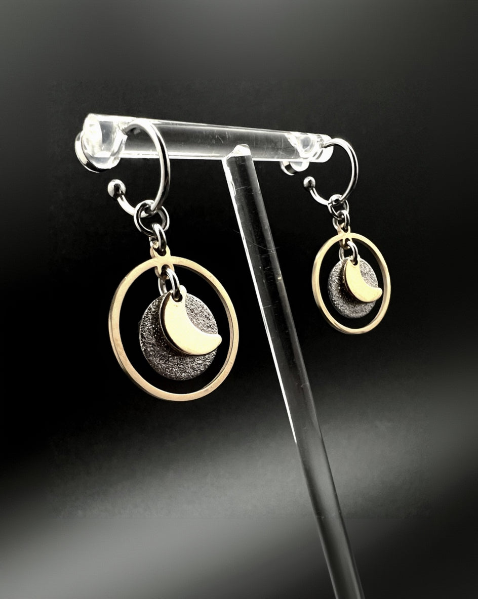 Mixed-metal stainless steel hoop earrings with detachable gold and silver moon and star charms and a textured disc in a 20 mm ring from Lawless Jewellery