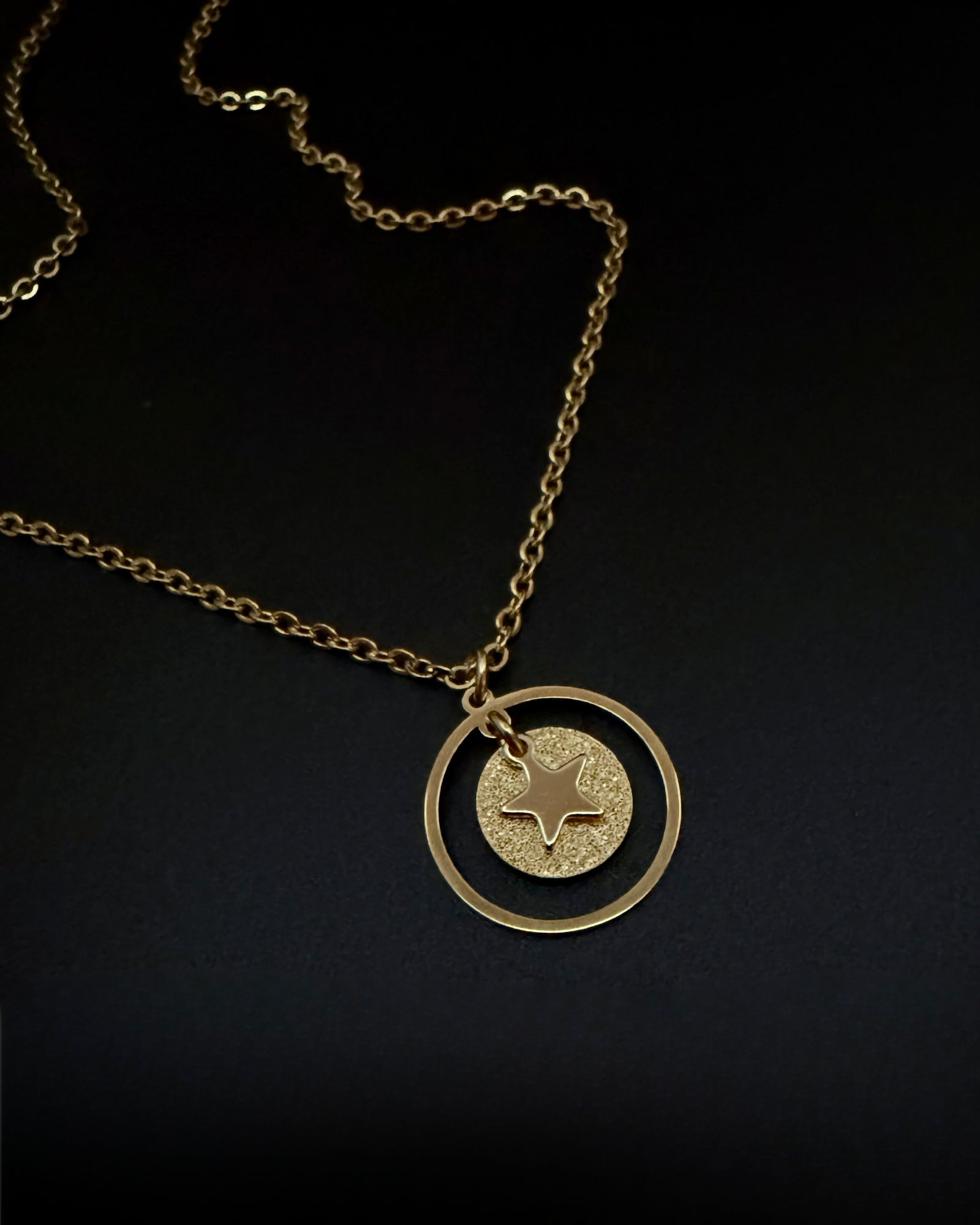 All gold reversible necklace with detachable moon and star charms, celestial pendant design in gold stainless steel, Urania Shapeshifter Necklace by Lawless Jewellery.