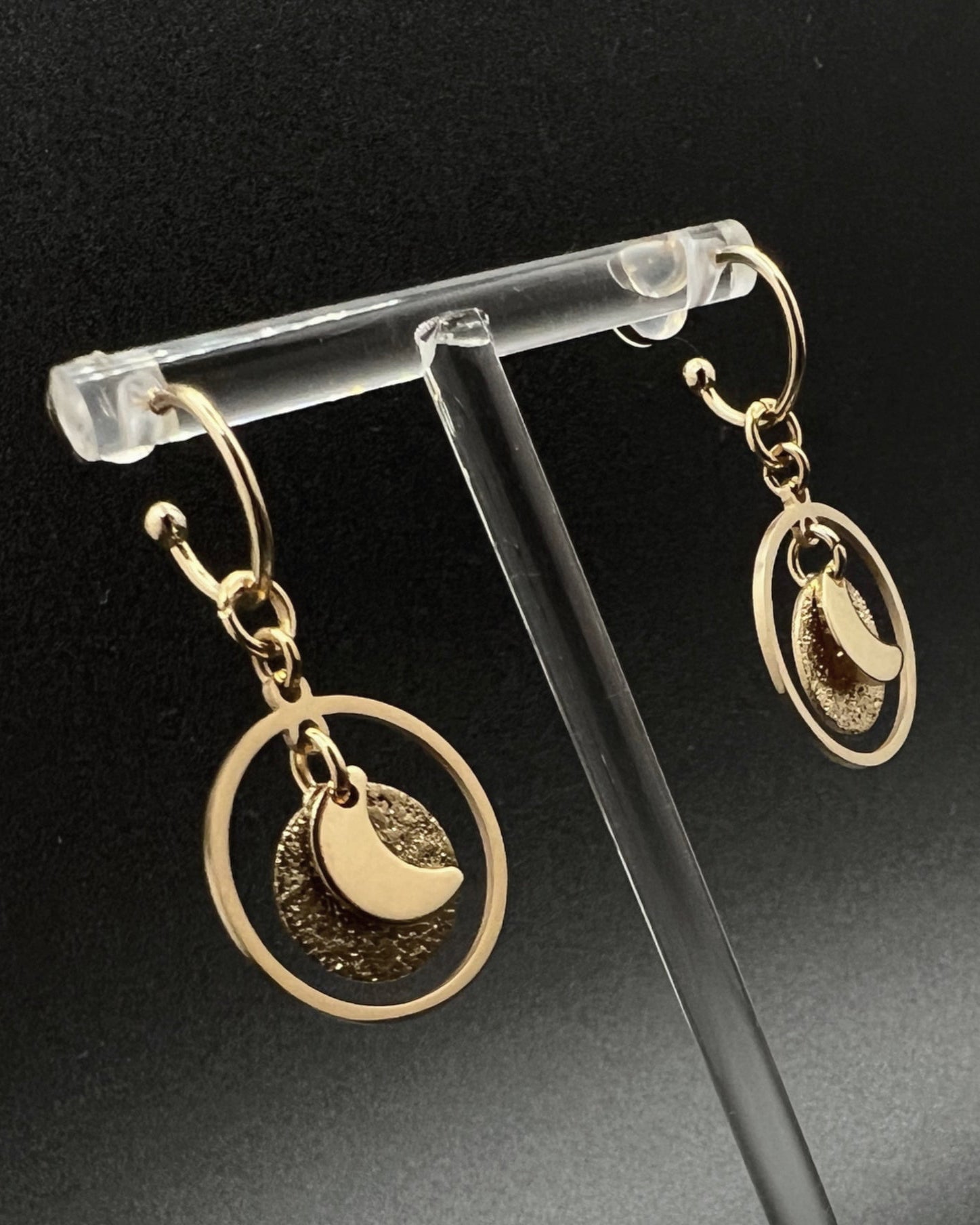 Gold stainless steel hoop earrings with detachable moon and star charms and a textured disc inside a 20 mm ring, 4 cm drop — Lawless Jewellery.