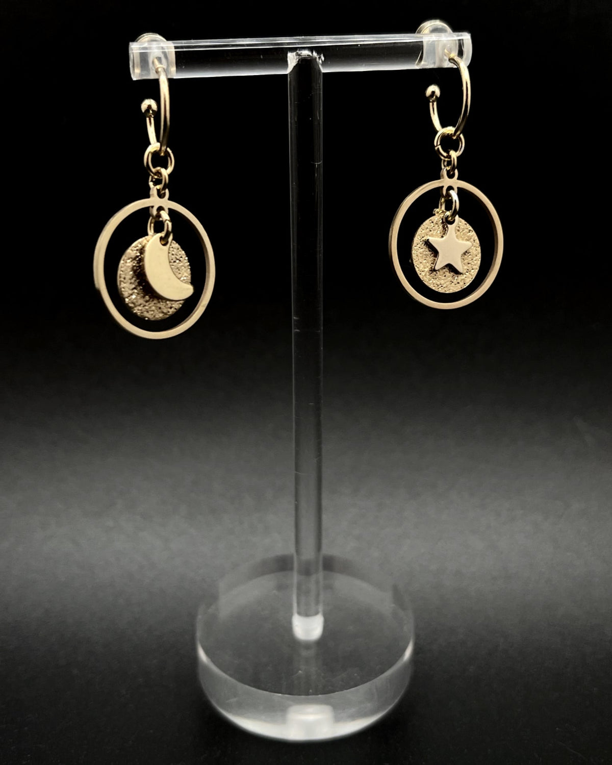 Gold stainless steel hoop earrings with detachable moon and star charms and a textured disc inside a 20 mm ring, 4 cm drop — Lawless Jewellery.