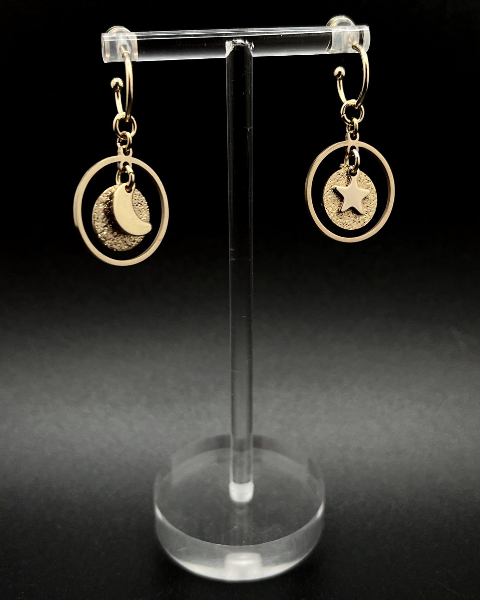 Gold stainless steel hoop earrings with detachable moon and star charms and a textured disc inside a 20 mm ring, 4 cm drop — Lawless Jewellery.