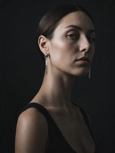 Model wearing a pair of white bead hoop earrings from Lawless Jewellery